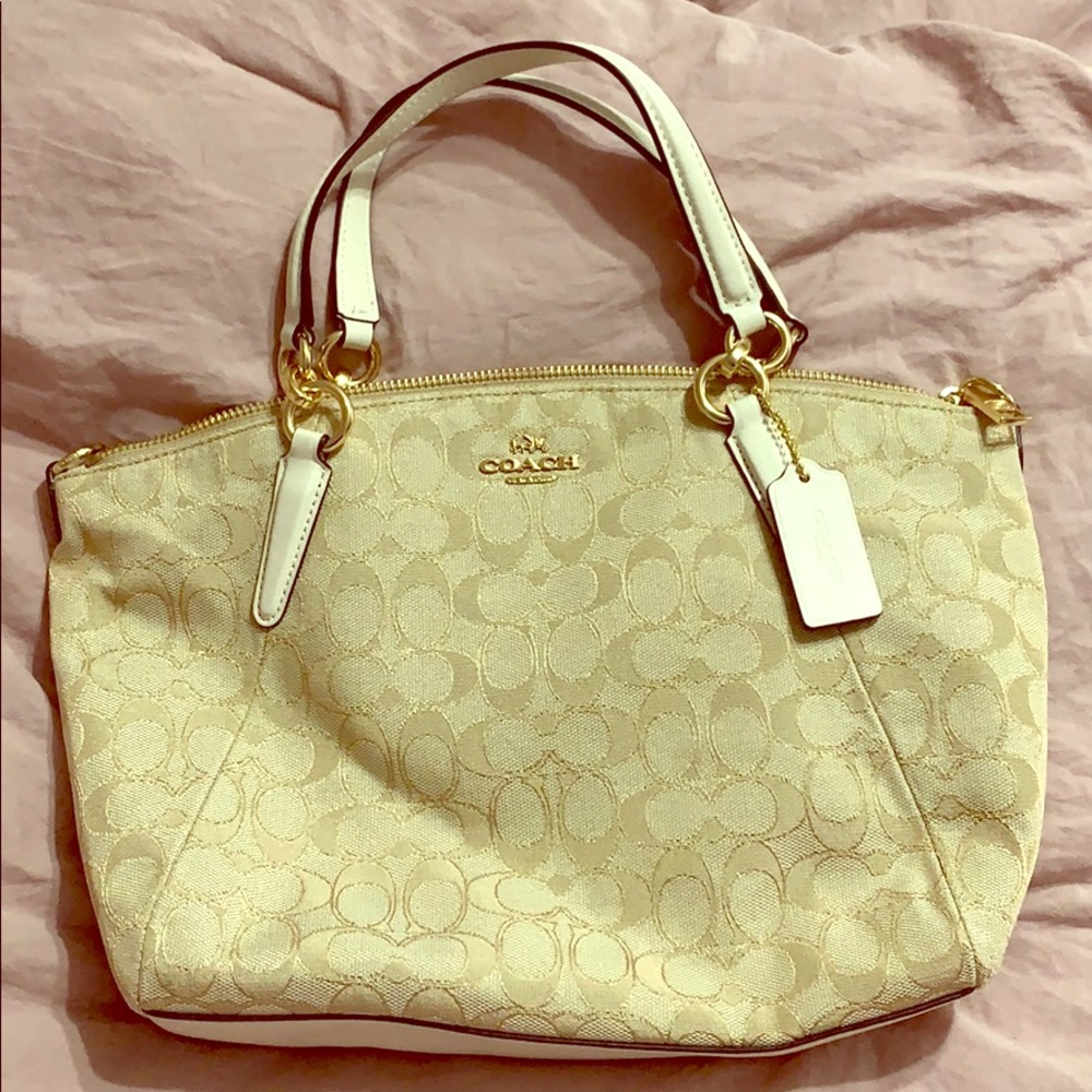 Cream colored Coach purse. Like brand new!